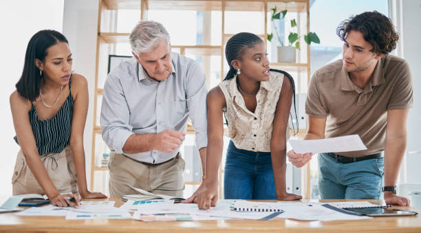 istock Business people, project management and documents, collaboration of ideas and brainstorming, team and paperwork. Marketing strategy, professional diversity and business meeting at marketing agency. 1475037175