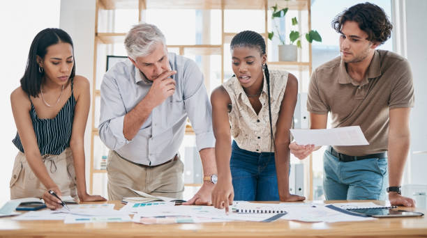 istock Business people, project management and documents, collaboration of ideas and brainstorming, team and paperwork. Marketing strategy, professional diversity and business meeting at marketing agency. 1475037176