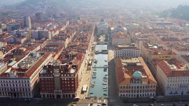 Drone aerial view of Grand canal with boats in Trieste, Italy
