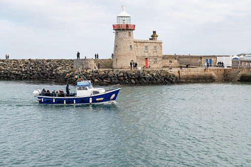Pinalia - Ireland's Eye Ferry passing the Lighthouse on the East Pier entering the Harbour, Howth, Dublin, Ireland
