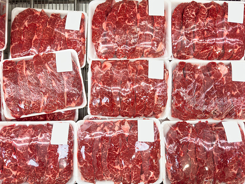 Steaks packages inside of a  butcher shop retail display