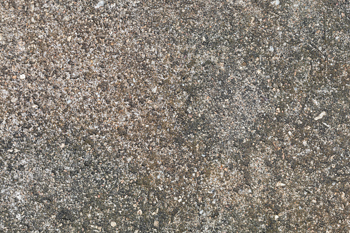 Texture pattern of a red granite stone rock with weathered aged grunge structure