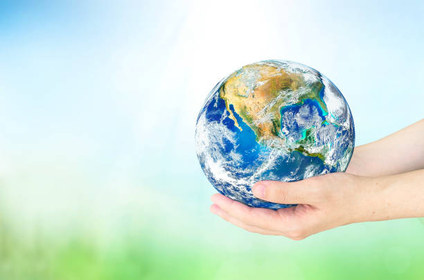 istock earth day concept, Human hands holding earth global on blurred nature background. Elements of this image furnished by NASA 1475044177