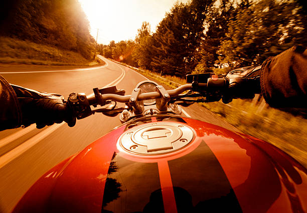 езда мотоцикл на закате - motorcycle handlebar road riding стоковые фото и изображения