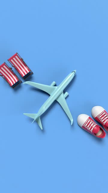 Vertical Airplane with Sunbeds and Shoes on Blue Background in 4K Resolution