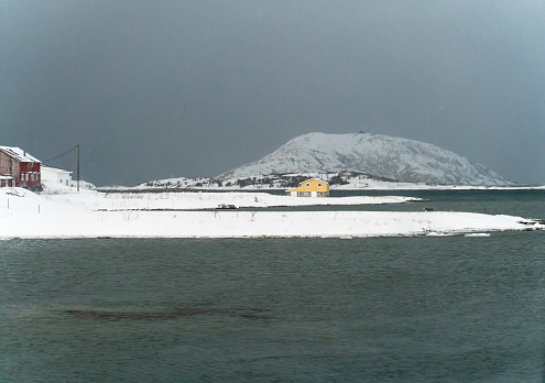 snowy nature view and coastline in town of tromso, norway