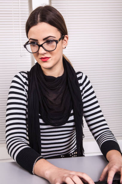 Portrait of confident senior executive manager. Stylish middle age woman in black business suit isolated on white background. Concept of human rights, feminism, old generation, skills and achievements