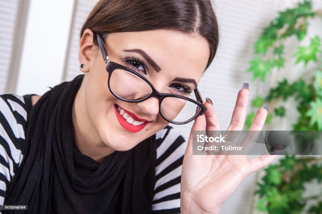 Young Business Girl In Office Stock Photo - Download Image Now.
