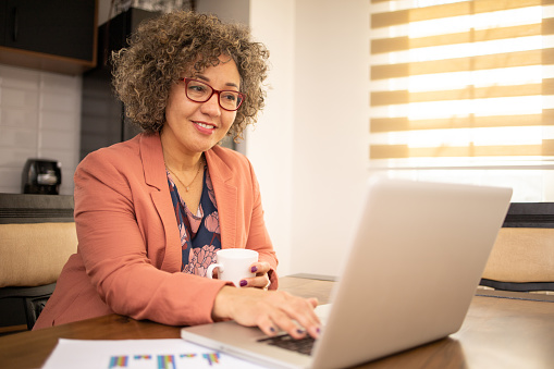 Shot of a mature woman working from home