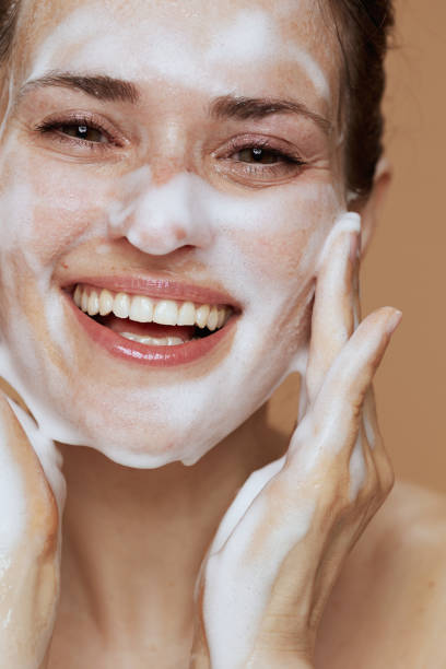 istock smiling modern female washing face 1475051044