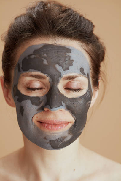 istock relaxed modern woman with cosmetic mask 1475051059