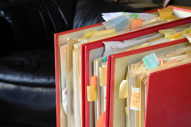 istock Messy file folders, red tape, bureaucracy, business concept, free copy space 1475051549