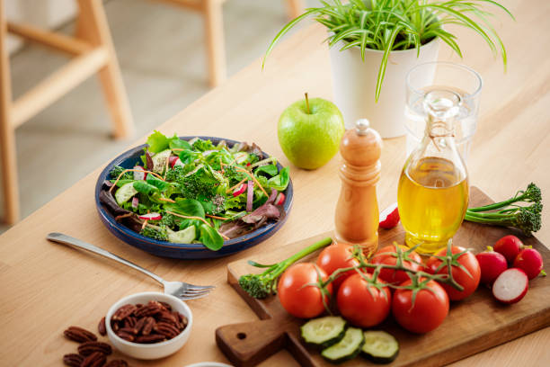 istock Fresh healthy salad plate served on wooden table 1475053021
