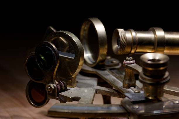 istock old sextant, spyglass, circle and compass lying on wooden table 1475053027