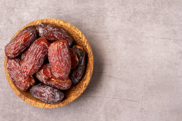 istock dates in a wooden bowl 1475053880