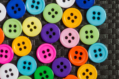 Colorful buttons background. lothing sewing in tailor shop