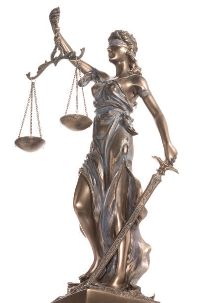 istock Bronze statue of justice isolated on the white background 1475055393
