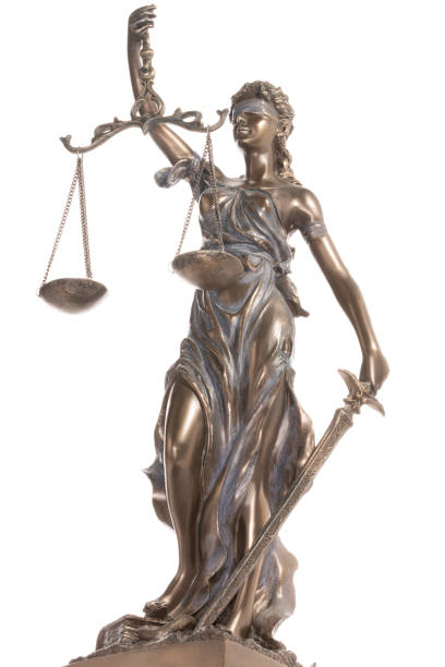 istock Bronze statue of justice isolated on the white background 1475055394