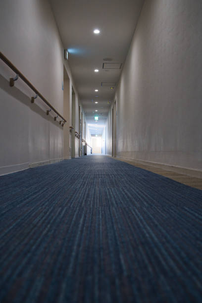 istock An empty, dark hotel hallway heading into the depths 1475055477