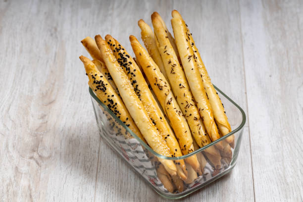Homemade bread sticks with sesame seeds. stock photo