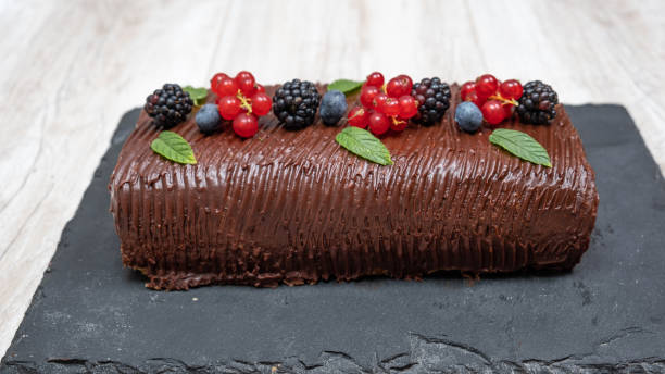 Chocolate and fruit roll cake stock photo