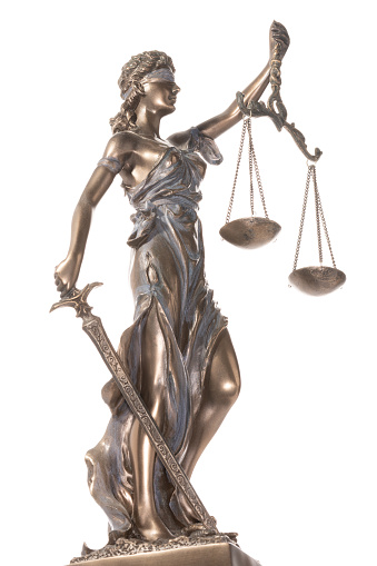 Bronze statue of justice isolated on the white background. Legal law and justice concept.