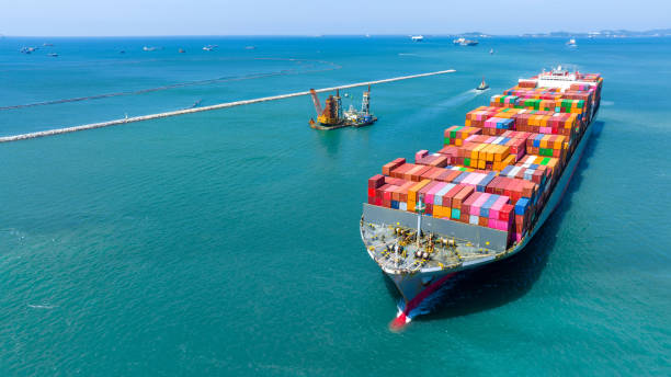 istock Aerial in front view of cargo ship carrying container and running for export goods from cargo yard port to custom ocean concept technology transportation , customs clearance. 1475057342