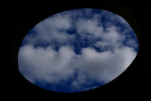 Cloudy sky behind the oculus, Valmagne Abbey, Hérault