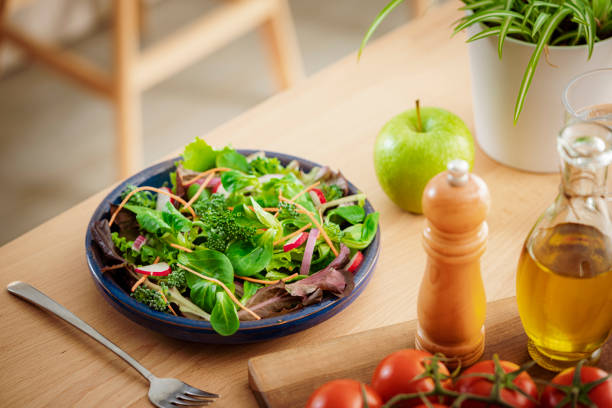 istock Fresh green salad plate served on wooden table 1475058161