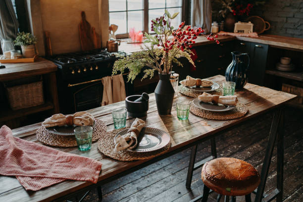 istock Table served for dinner. Cozy kitchen interior. Cultery and napkins on table for guests. Family breakfast. Dining time. No people. 1475061583