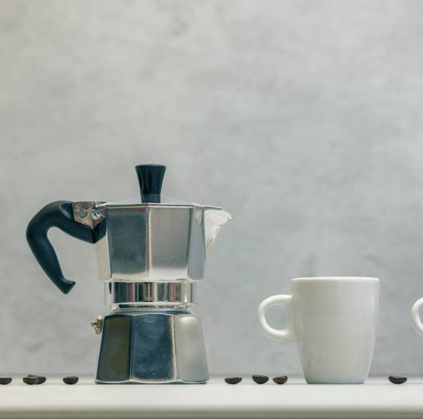 istock Metal geyser coffee maker on table with cup 1475062139