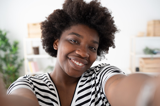 Selfie of smiling young african american young woman