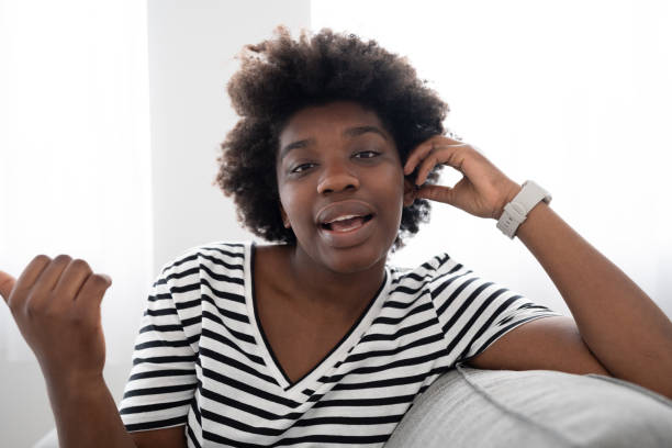 istock Relaxing black woman talking to camera 1475063870