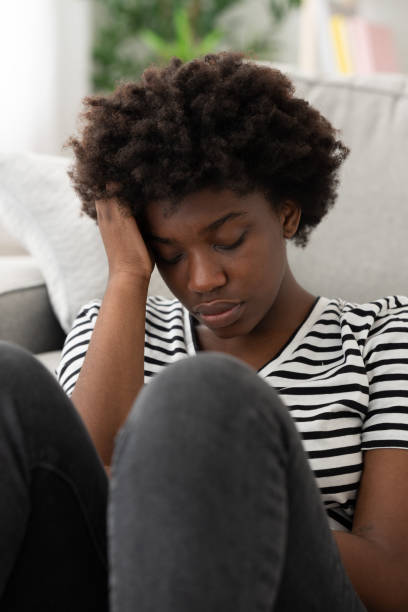 istock Sad african american woman looking down 1475063886