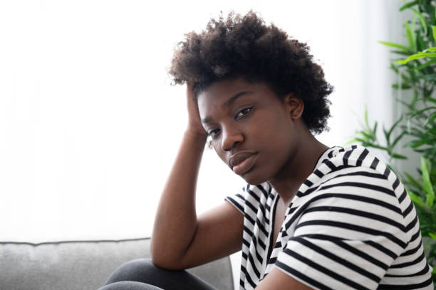 istock Sad black woman looking at camera 1475064050