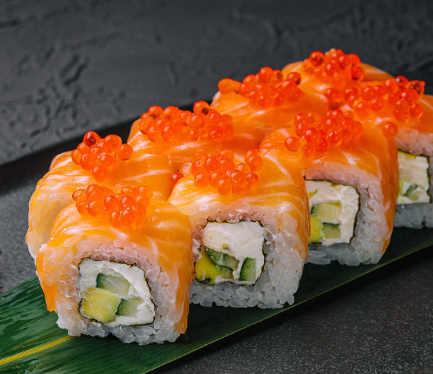 istock Philadelphia Sushi with avocado on black dish 1475064253