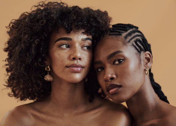 Shades Of Brown Portrait of attractive models with diverse skin tones posing for beauty, skin and makeup. Natural skincare, hair care and makeup. black hair stock pictures, royalty-free photos & images