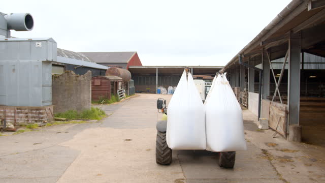 Forklift Transporting Agricultural Nitrogen Sulphur Fertiliser In Heavy-Duty Bulk Bags on a Farm