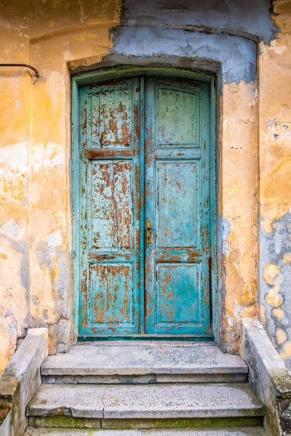 istock Old wooden door with flaking paint 1475070472