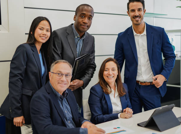 istock Multiracial business people smiling on camera inside modern office 1475070534