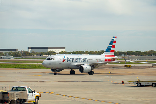 American Airlines Airbus A319-112 aircraft with registration N701UW taxiing to gate at Memphis  International Airport in April 2022.