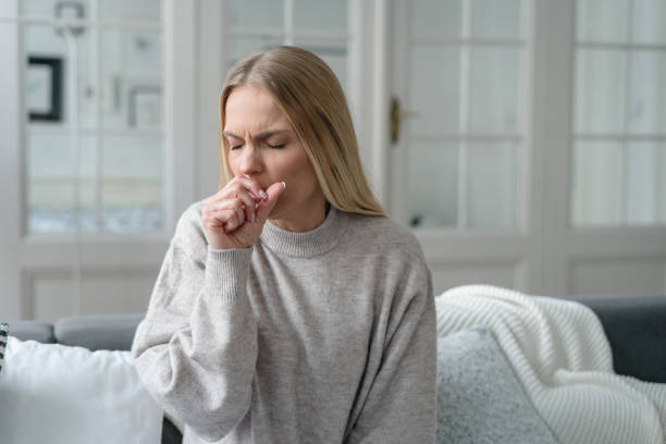 sick female coughing and has viral infection stock photo