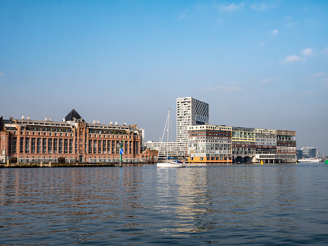 Under the radiant sun, Rotterdam's Oude Haven Historical Center and bustling harbor come to life, showcasing the dynamic energy of the city center. This picturesque scene captures the vibrant atmosphere and rich maritime heritage of Rotterdam on a beautiful sunny day
