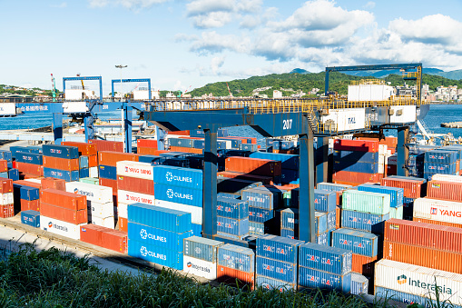 Keelung City, Taiwan- August 14, 2022: Panoramic view of the container yard and crane equipment at Port of Keelung, Taiwan. It's an international logistics company.
