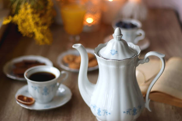 istock Tea, Cookies, Chocolate, Blueberries, Juice, Book and Candles 1475076799