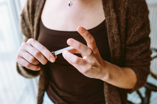 istock hands young girl filing nails 1475078151