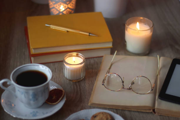 istock Books, Glasses, E-Reader, Pen, Tea, Cookies and Candles 1475078431