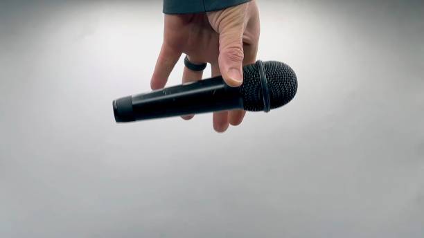 istock Drop the Mic on Sequence - Male Hand Black Mic 1475078551