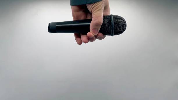 istock Drop the Mic on Sequence - Male Hand Black Mic 1475078552