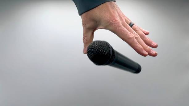 istock Drop the Mic on Sequence - Male Hand Black Mic 1475078705